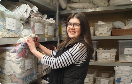 Volunteer packing clothes