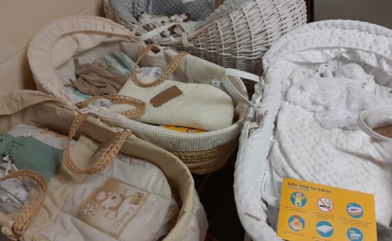 Moses baskets packed with bedding and comforters ready for new family