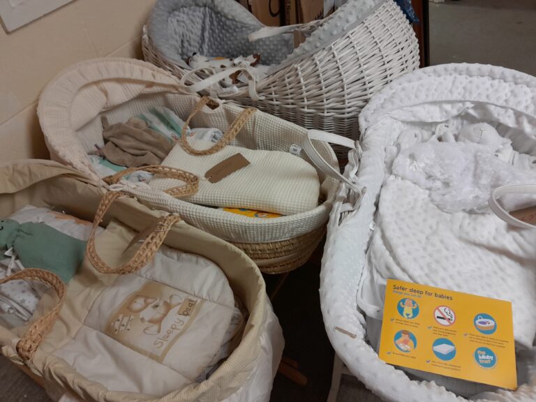 Moses baskets packed with bedding and comforters ready for new family