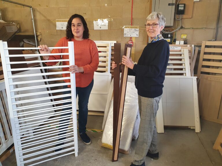 Volunteers sorting cot donations at the Baby Bank Network warehouse
