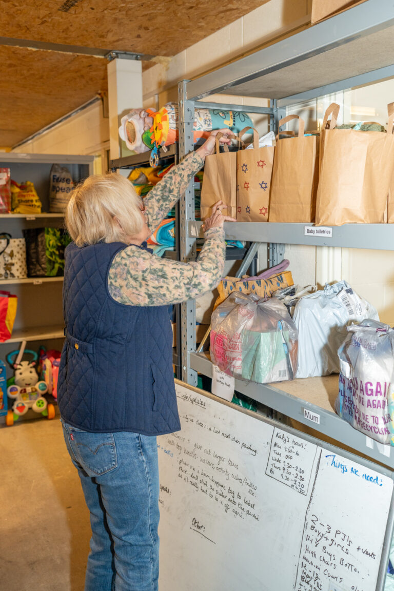Baby Bank Network Bristol Volunteer choosing pre-loved donations for a family in crisis.